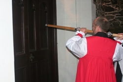The Bishop knocks on the Cathedral door with his pastoral staff to gain admittance.